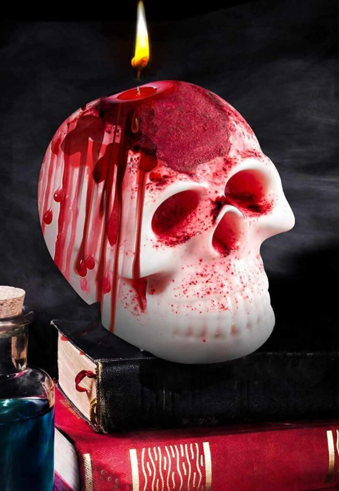 Lit skull-shaped candle
